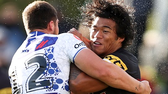 Brian To’o is tackled by Matt Doorey during his shift of chalking up 266 running metres.