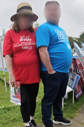 A Brethren member (right) allegedly blocking a Labor campaign worker from reaching voters.