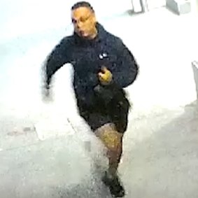 A security camera still image of the knife-wielding attacker as he fled the scene.