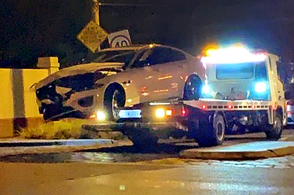 Mr Smith’s car being towed from the crash site on Saturday night.