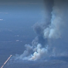 Body found amid battle to contain Queensland blazes