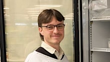 PhD student Maxim Buckley earns around $18 per hour for his research into cancer.