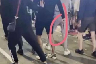 A screen grab from a video showing a person holding a knife at the Royal Easter Show on Monday night.