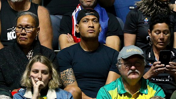 Israel Folau watches his wife Maria play in the Netball World Cup match between New Zealand and Australia in England on Thursday.