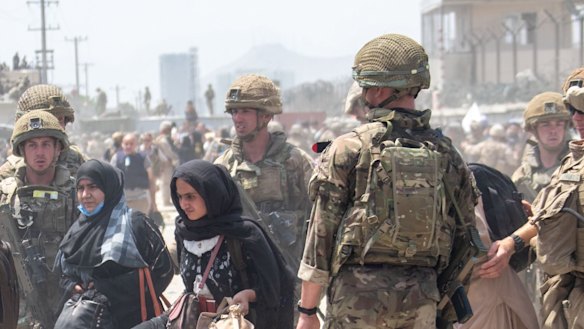 British troops try to help evacuate some Afghans amid chaotic scenes outside the airport in Kabul.