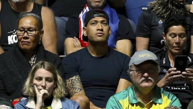 Israel Folau watches his wife Maria play in the Netball World Cup match between New Zealand and Australia in England on Thursday.