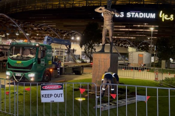 Nicky Winmar’s statue being removed from out the front of Optus Stadium on Sunday morning.