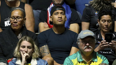 Israel Folau watches his wife Maria play in the Netball World Cup match between New Zealand and Australia in England on Thursday.