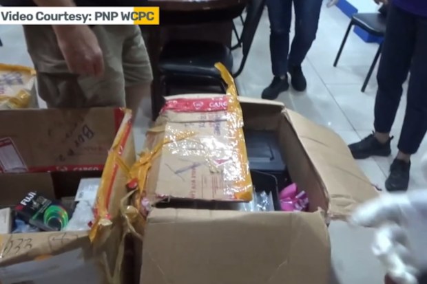 Thomas Markle’s son seen handing over VHS tapes and dismantled computers to police in footage released by Philippine authorities.