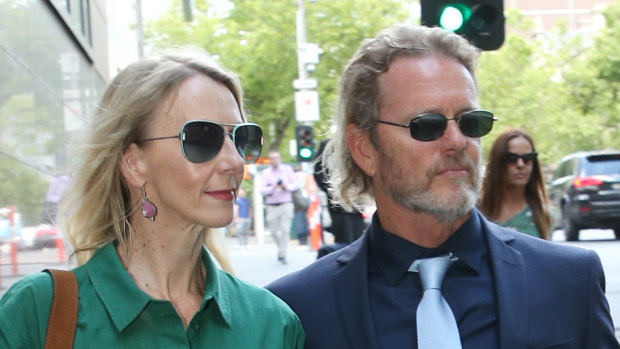 Craig McLachlan and his partner Vanessa Scammell leave Melbourne Magistrates Court on Wednesday.
