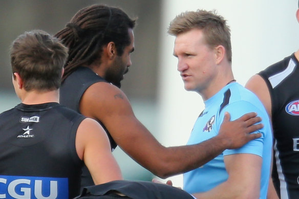 Heritier Lumumba (left), then Harry O’Brien, with Nathan Buckley in 2013.