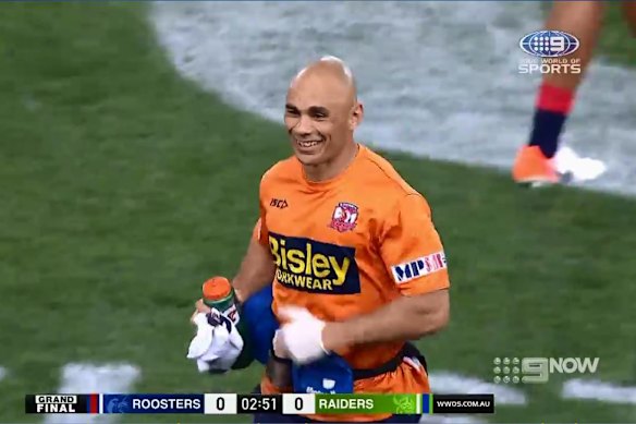 Roosters trainer Travis Touma tries to laugh off his gaffe in the 2019 grand final.