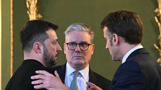Volodymyr Zelensky, Ukraine’s president (left); Keir Starmer, UK’s prime minister; and Emmanuel Macron, France’s president, embrace after meeting on Sunday.