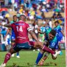 Reds winger Suliasi Vunivalu (left) trips Fijian Drua’s Kitione Salawa during Queensland’s loss in Suva.