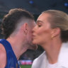 Brisbane player Lachie Neale leans in to give Channel 7 reporter Abbey Holmes a kiss at Marvel Stadium last Friday.