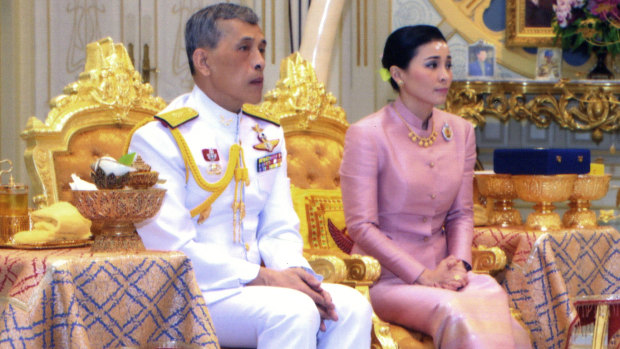 Thailand's King Maha Vajiralongkorn (left) sits with Queen Suthida Vajiralongkorn Na Ayutthaya in a photo released on Wednesday.