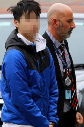 The second man allegedly involved in the abduction arrives in Queensland in cuffs and flanked by police.