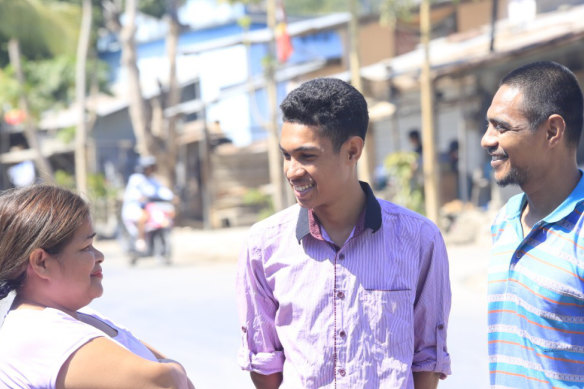 Pedro Unamet Remeijo (centre) in Dili with his parents Simplicio and Joanna. He hopes to study geology. 