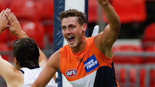 Harry Perryman celebrates a goal in Saturday night's win over Geelong.