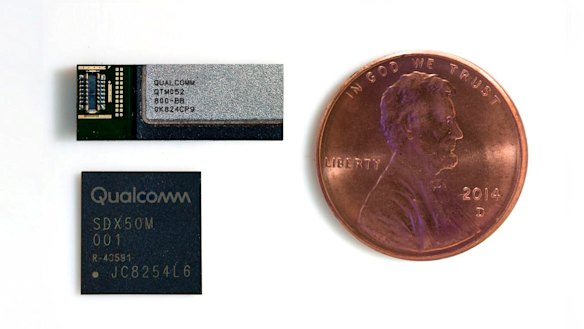 A Qualcomm 5G modem (lower). This would need to be used in conjunction with at least three RF modules (upper) to connect to 5G networks. US penny (about the size of a five cent coin) for scale.
