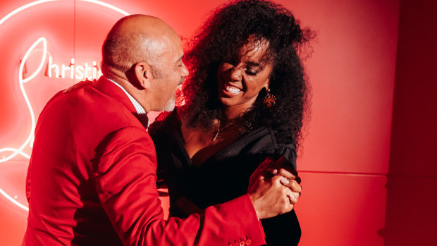Christian Louboutin and 'The Voice' coach Kelly Rowland hit the dancefloor in the Loubi lounge.