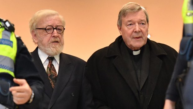 Robert Richter QC arrives at Melbourne Magistrates Court with George Pell in July 2017.