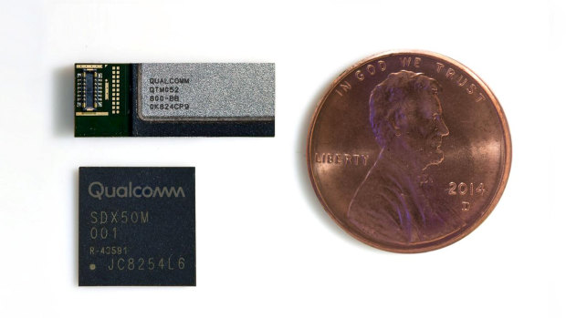 A Qualcomm 5G modem (lower). This would need to be used in conjunction with at least three RF modules (upper) to connect to 5G networks. US penny (about the size of a five cent coin) for scale.