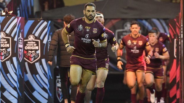 Departing legend: Greg Inglis leads the Maroons onto the MCG arena for game one of Origin in 2018.