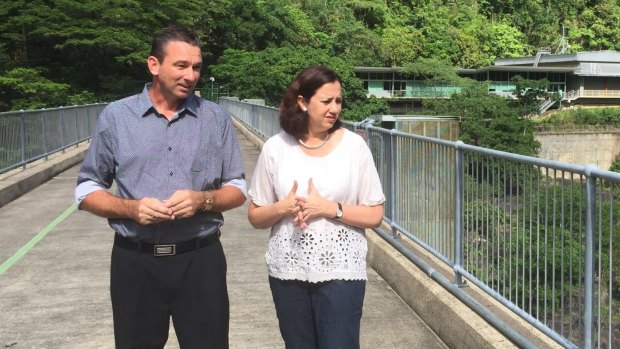Craig Crawford, pictured with Premier Annastacia Palaszczuk, says the extent of the risks to residents around the dam are not yet well understood.