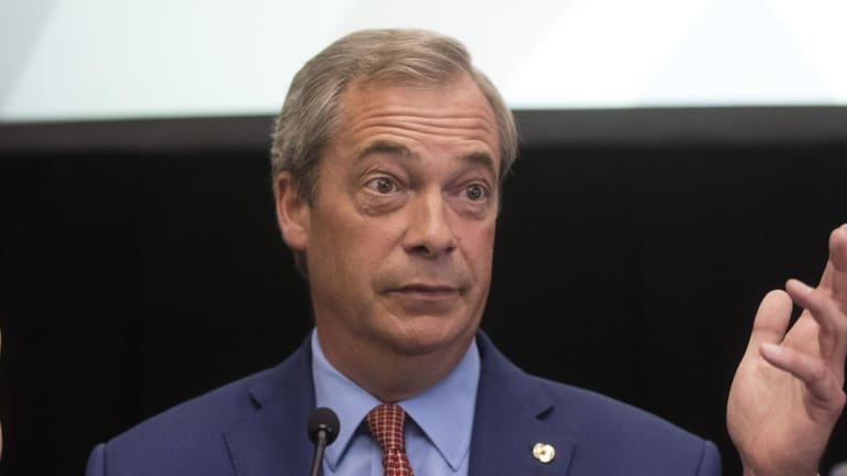 Nigel Farage, leader of the UK Independence Party (UKIP), gestures whilst speaking during a news conference to announce his resignation as UKIP party in July.