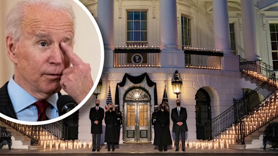 Biden wipes away a tear, the candle-lit ceremony to honour the dead at the White House.