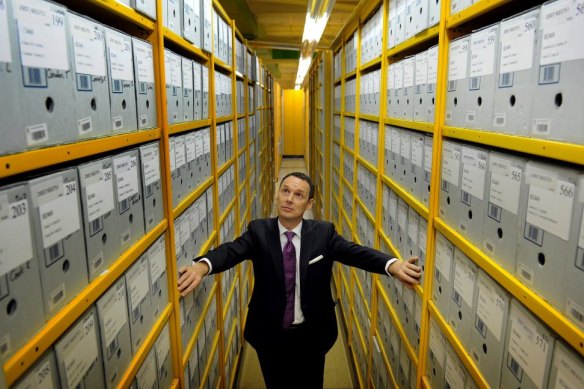 National Archives Director-General David Fricker stands among the archives boxes at its Canberra repository in 2012.