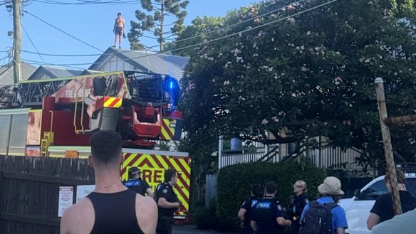 One man was arrested after police coaxed him down from a rooftop.