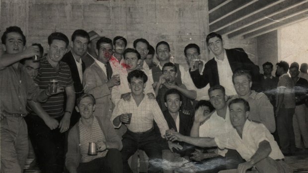 Denis O’Mara (with beer stein) in 1960 with workmates at the steps he helped to build at the Sydney Opera House.