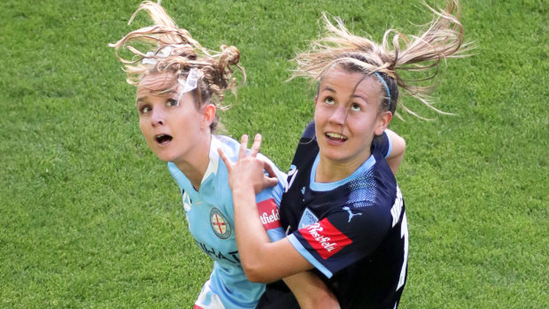 City's Rhali Dobson tangles with Angelique Hristodoulou of Sydney FC.