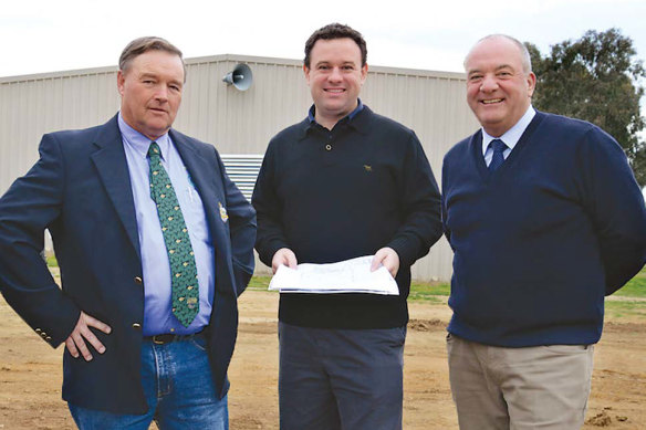 Clay-target association president Robert Nugent, Sports Minister Stuart Ayres, centre, and Wagga MP Daryl Maguire. 