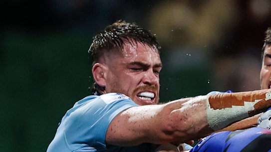 Western Force and NSW Waratahs players scuffle after a try