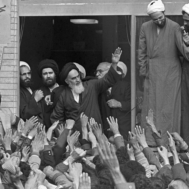 The Ayatollah Ruhollah Khomeini waves to followers in Tehran in 1979.