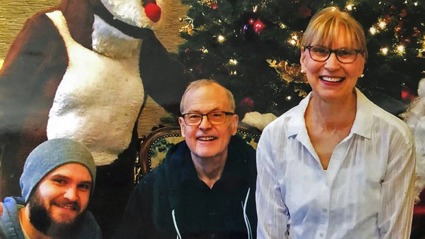 Nathan Lambrecht (left), his father, Doug (centre), and his mother, Karen, in December 2019, two months before Doug Lambrecht died from COVID-19. 
