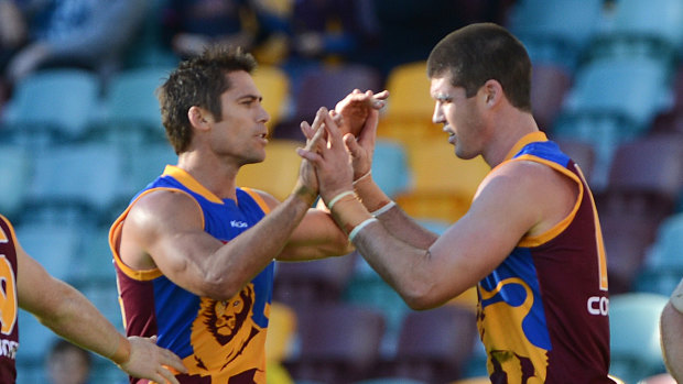 Former teammates Simon Black, left, and Jonathan Brown have been inducted into the AFL Hall of Fame. 