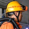 Rescue workers prepare to descend into the coal mine that was the scene of a deadly explosion.