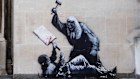 A photo released by Banksy of his new artwork, which portrays a judge beating a protester with a gavel at the Royal Courts of Justice in London.