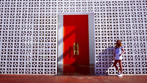 Catherine Chisholm at entrance of Parker Palm Springs hotel.