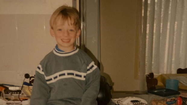 Dylan Allen, who died from alcohol-induced hepatitis in 2022. He is pictured here, aged four, sitting on the kitchen bench.