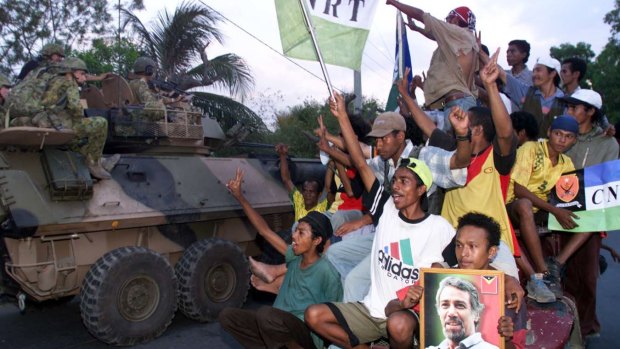 Pro-independence supporters cheering the Australian troops