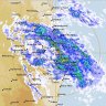 SEQ cops all-day drenching while western rivers see highest peaks in 10 years