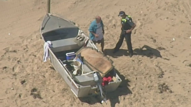 Rescue crews were called to an Anglesea beach after a small boat capsized just after 2pm on Saturday.