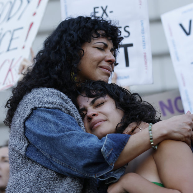 Mitzi Rivas, left, hugs her daughter Maya Iribarren during an abortion-rights protest at City Hall in San Francisco following the Supreme Court’s decision to overturn Roe v Wade.