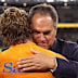 Michael Hooper of the Wallabies and coach Dave Rennie celebrate.