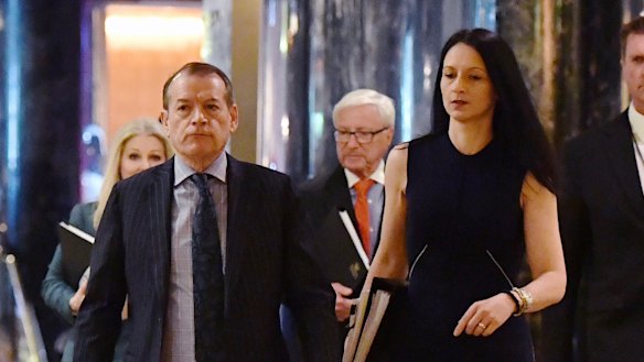 Crown Resorts executive chairman John Alexander (left) and company secretary Mary Manos arrive at the company's AGM on Thursday. 